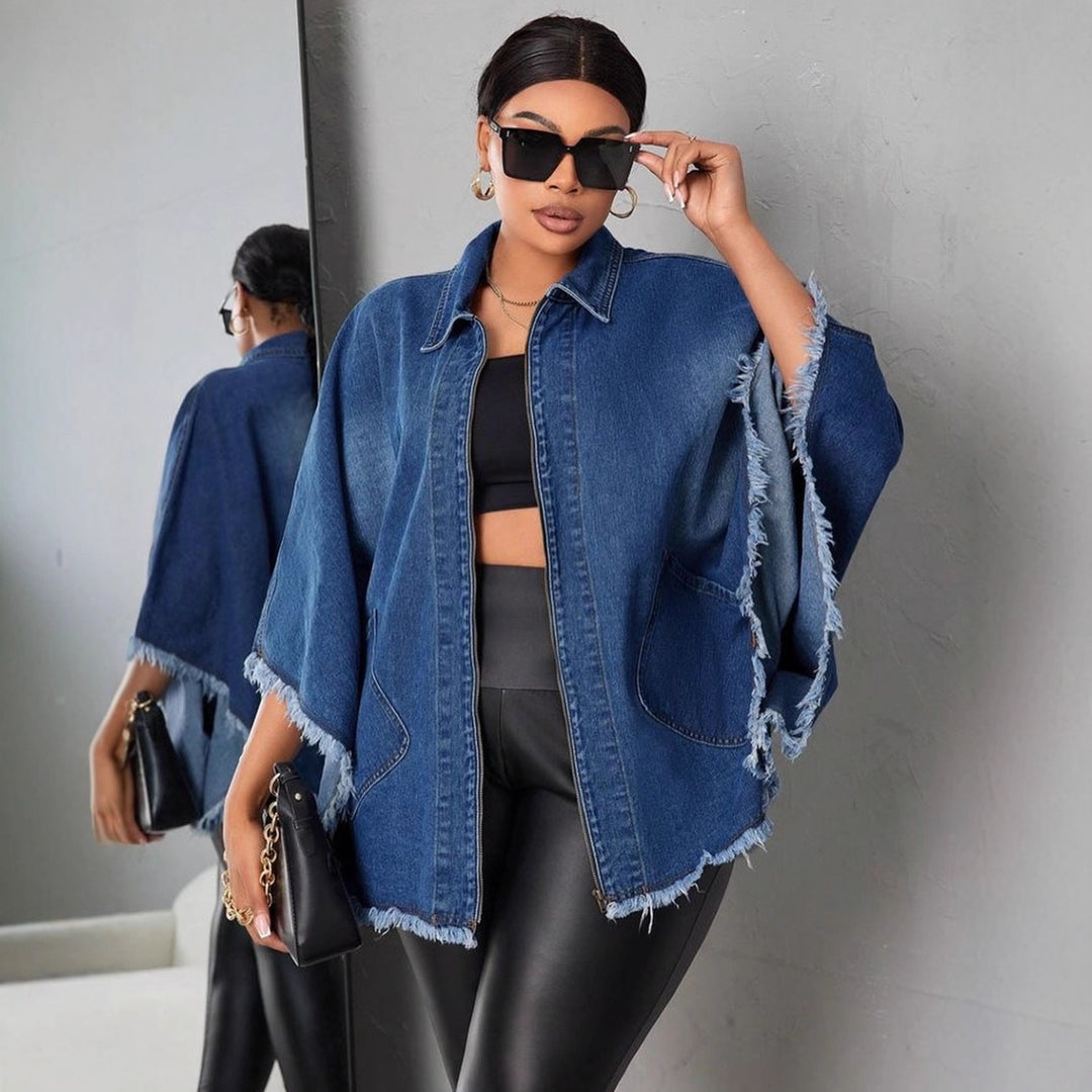 Blue denim loose jacket with notch lapels, chest flap pockets, and frayed hem edges