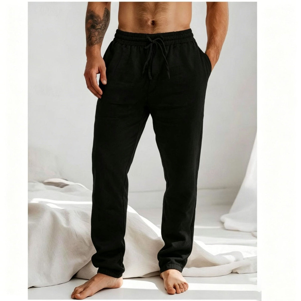 Men's loose straight-leg trousers in black with elastic drawstring waist
