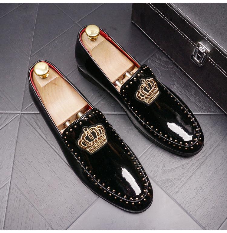 Men's black leather loafers with crown patch, red-lined collar, slip-on style