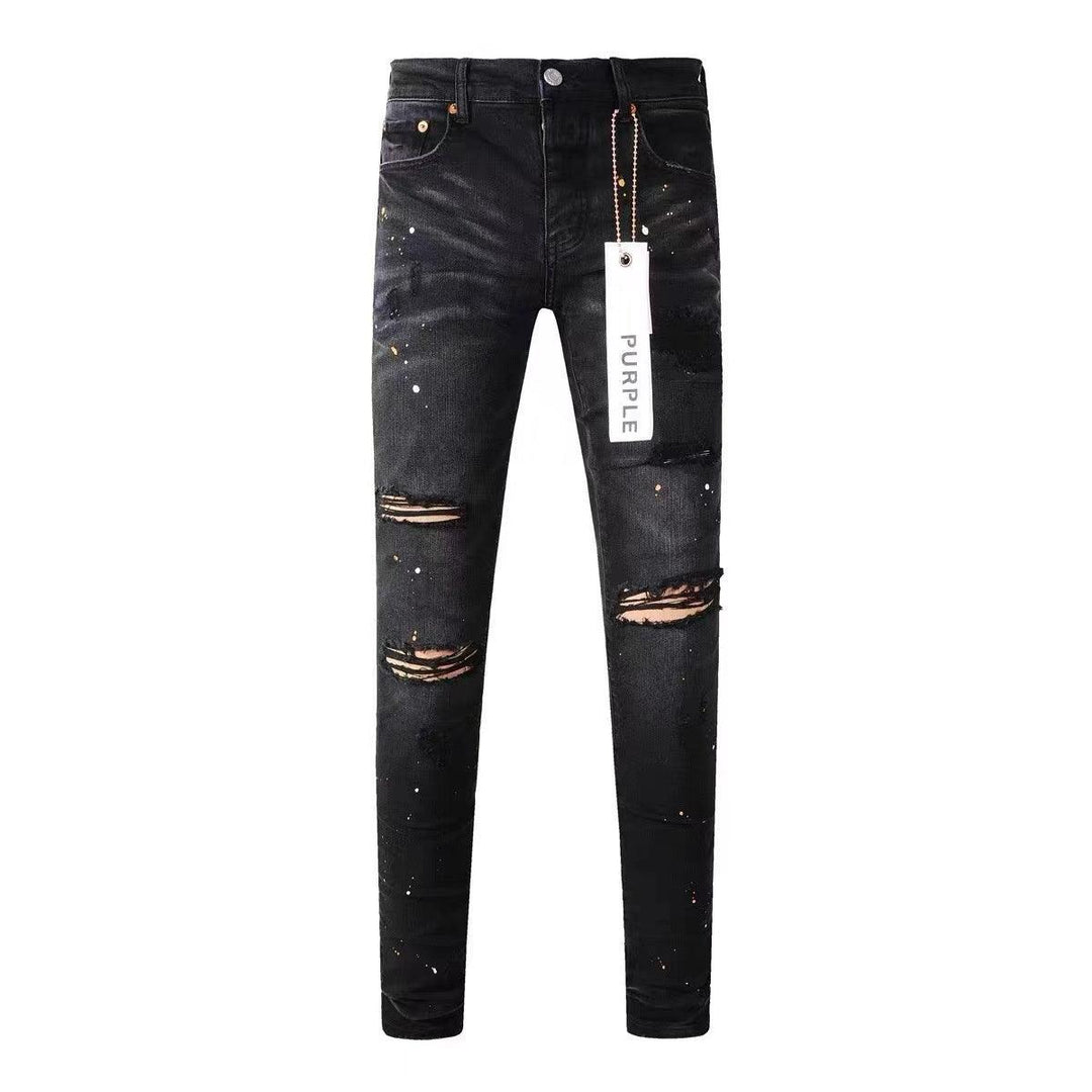 Black distressed straight jeans with ripped knees and frayed patch details.