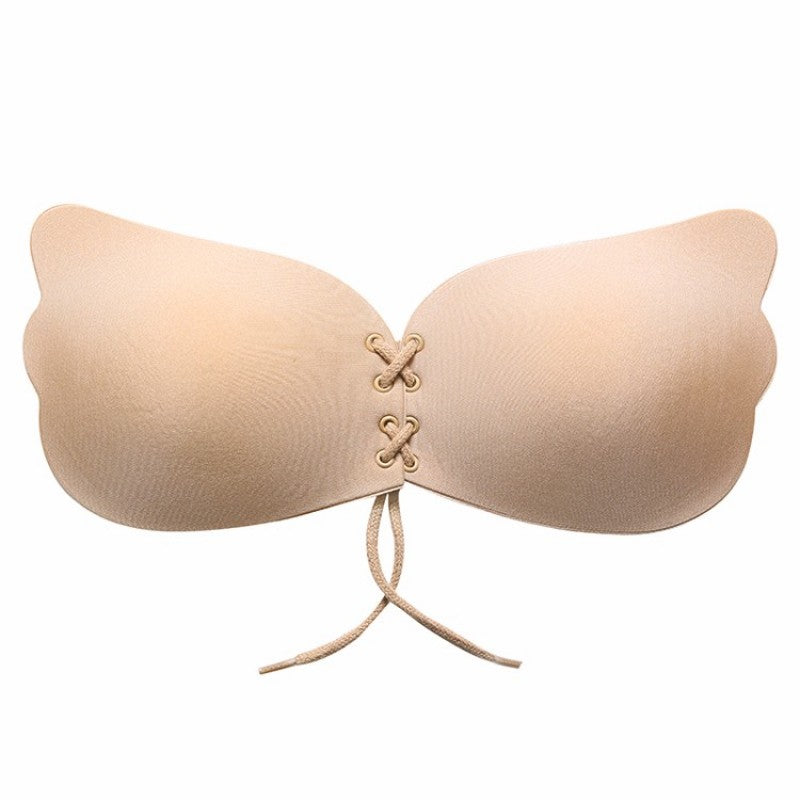Nude beige strapless bra with scalloped cups and lace-up center ties