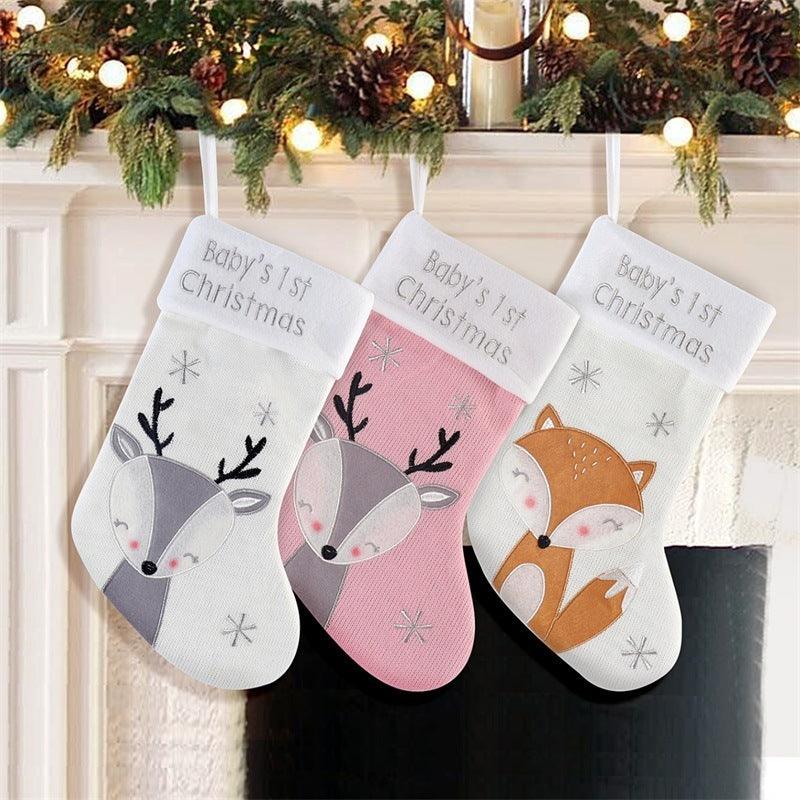 Set of three baby’s first Christmas wool stockings with fox designs and “Baby’s 1st Christmas” text