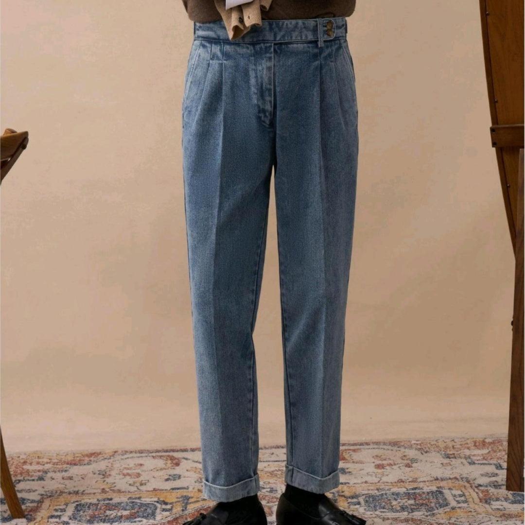 Light-blue high-waist trousers with pleats, belt loops, and button closure