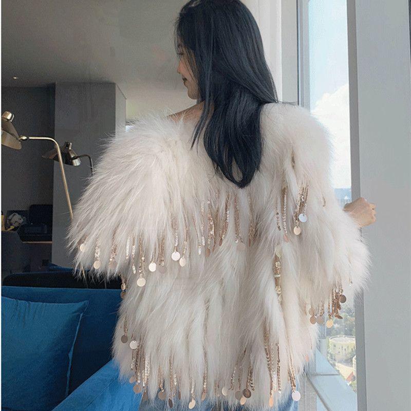 White faux fur tassel coat with back view fringe and hanging round charms