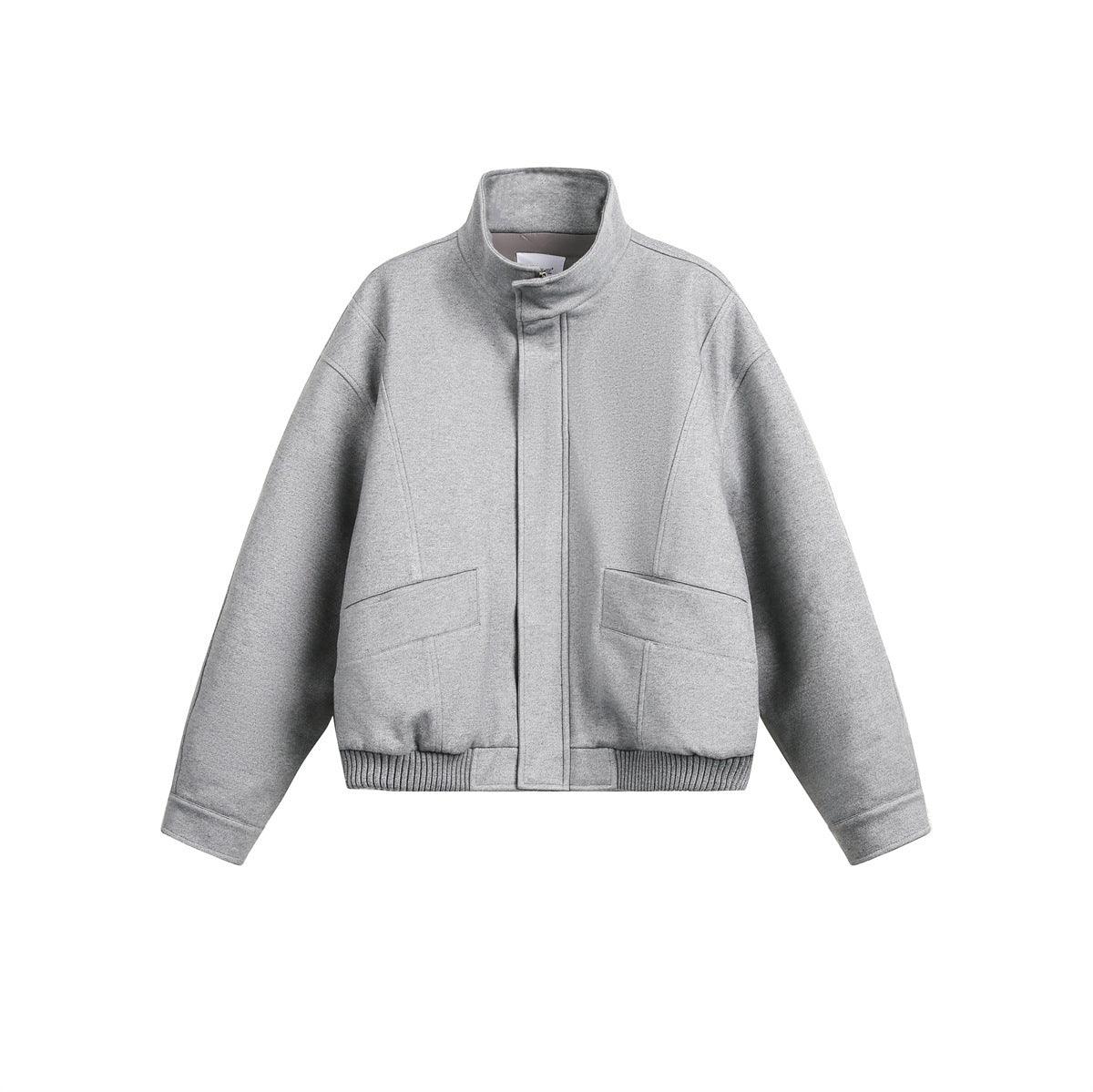 Light gray zip-front padded coat with stand-up collar and two front pockets