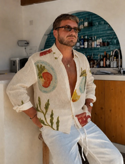 Men's white print button-up shirt with open collar and colorful still life motifs