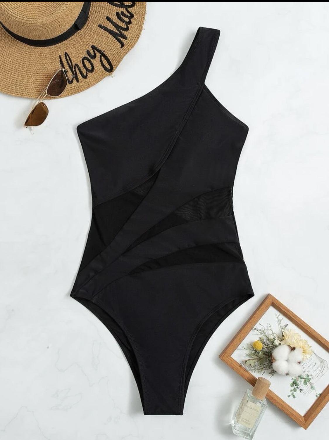 Black one-piece swimsuit with asymmetrical neckline and diagonal mesh detailing