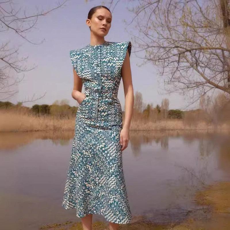 Peacock blue printed round-neck dress with cap sleeves and button front