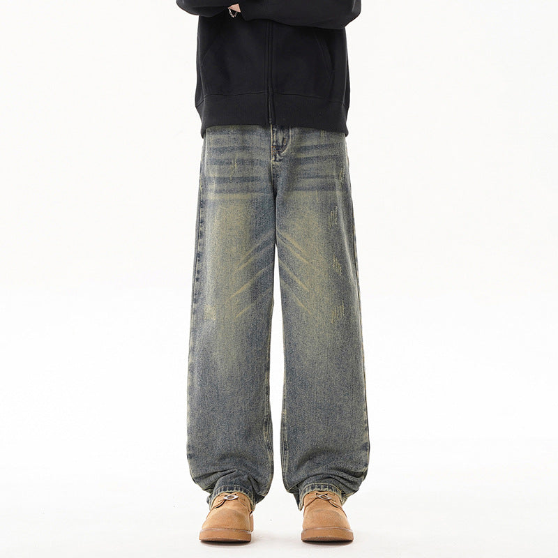 Light blue distressed men’s jeans with wide straight legs