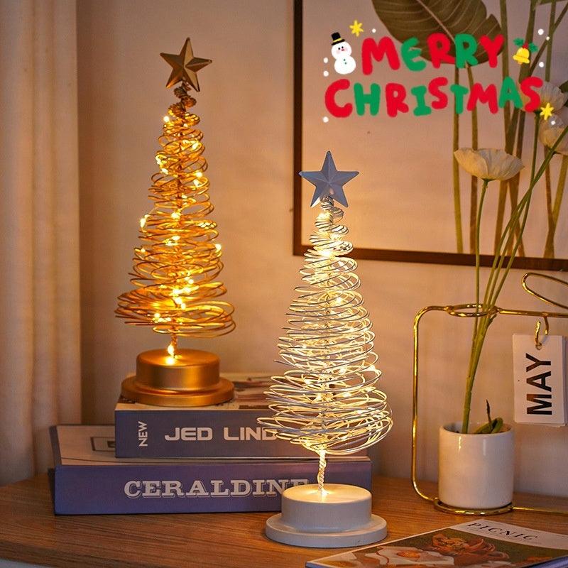 Spiral tree desk lamp set with star topper, glowing warm white and gold coils on bases.