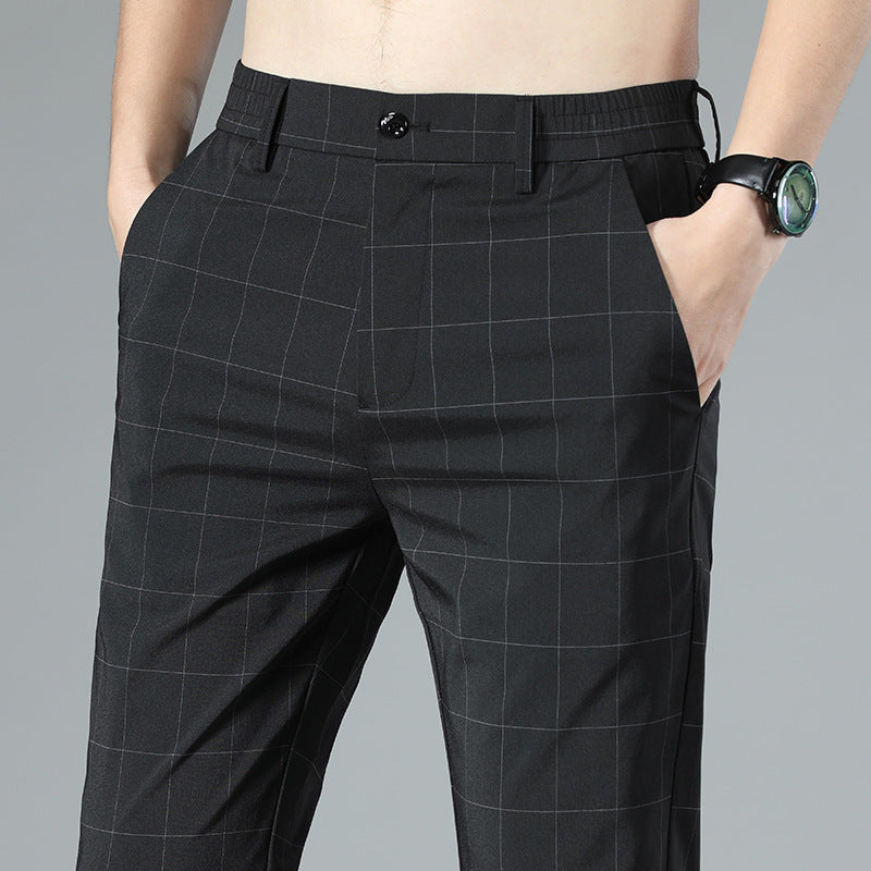 Men's black plaid slim pants with side pockets and tapered ankle-length cut