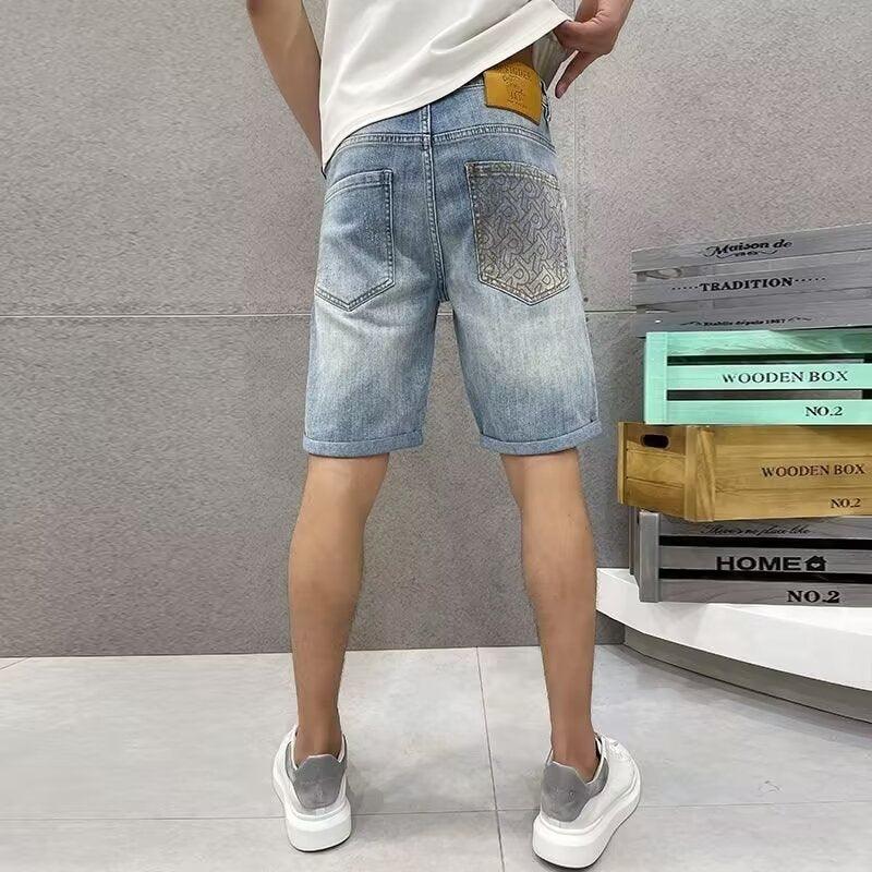 Men's light-wash denim shorts, side back view with embroidered patch pocket