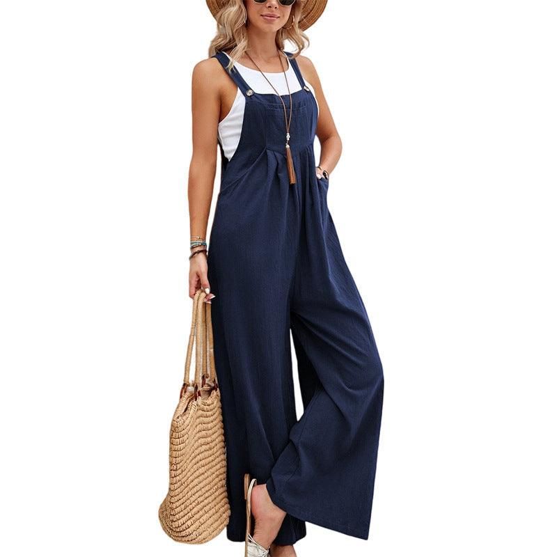 Dark blue suspender trousers with square bib front, adjustable straps, wide straight legs