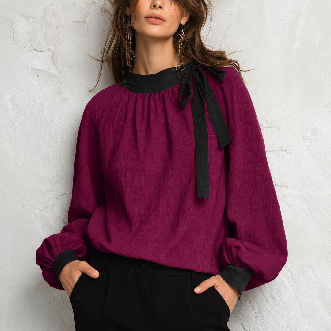Women's color-block blouse top in wine red with black neckline and ribbon ties
