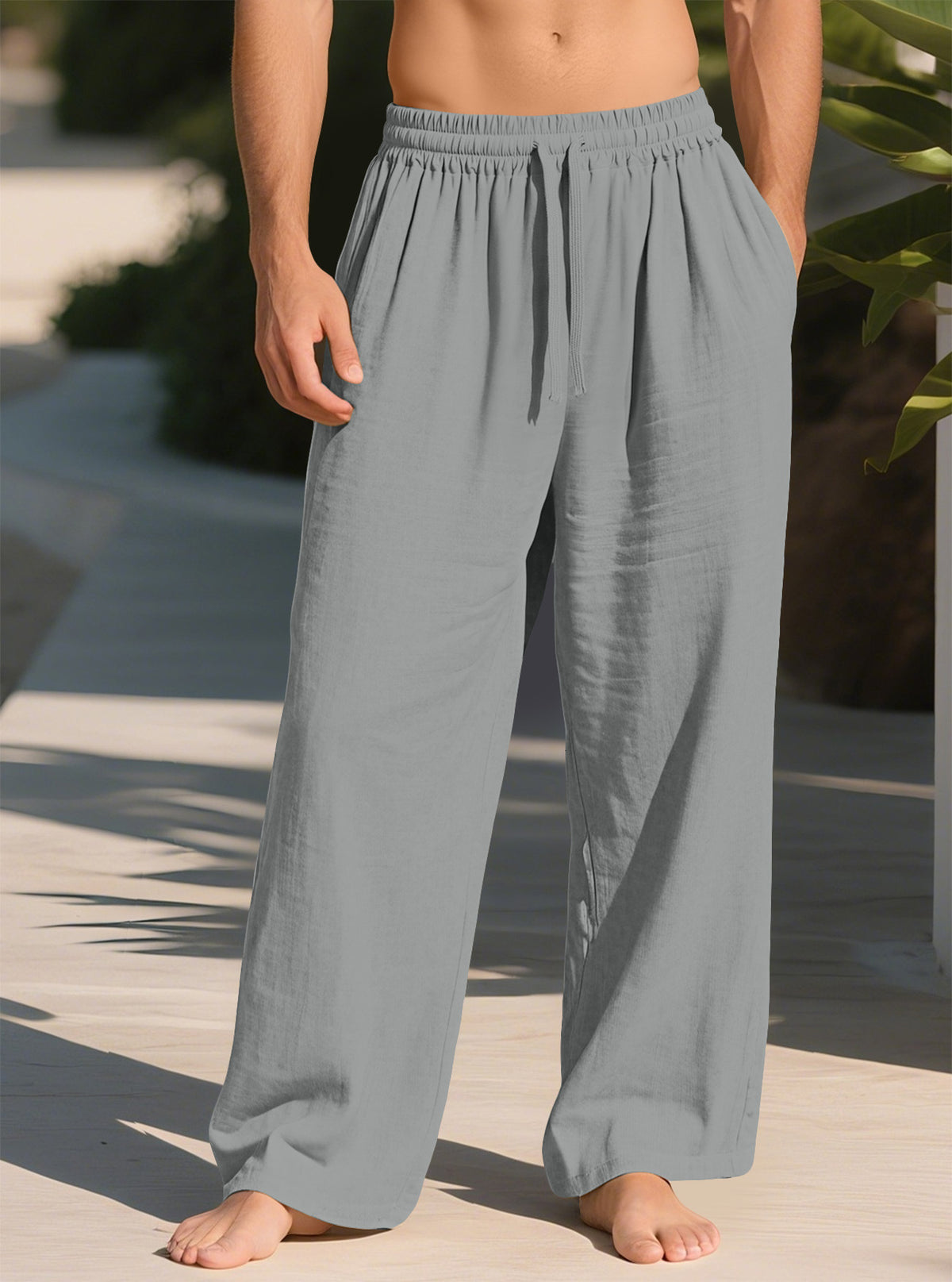 Men's loose straight casual pants in grey, with elastic waistband and drawstring