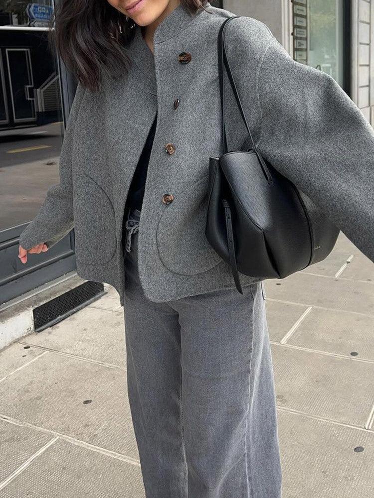 Gray single-breasted jacket with notch lapel, button front, and outside seam pockets
