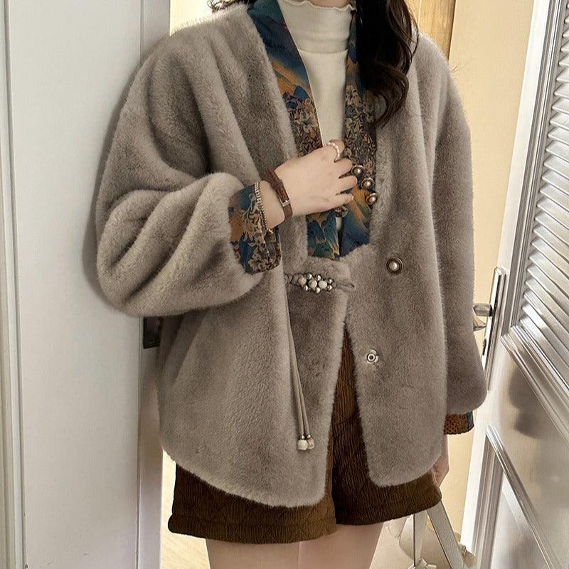 Light gray mink fashion coat with button front and large voluminous sleeves
