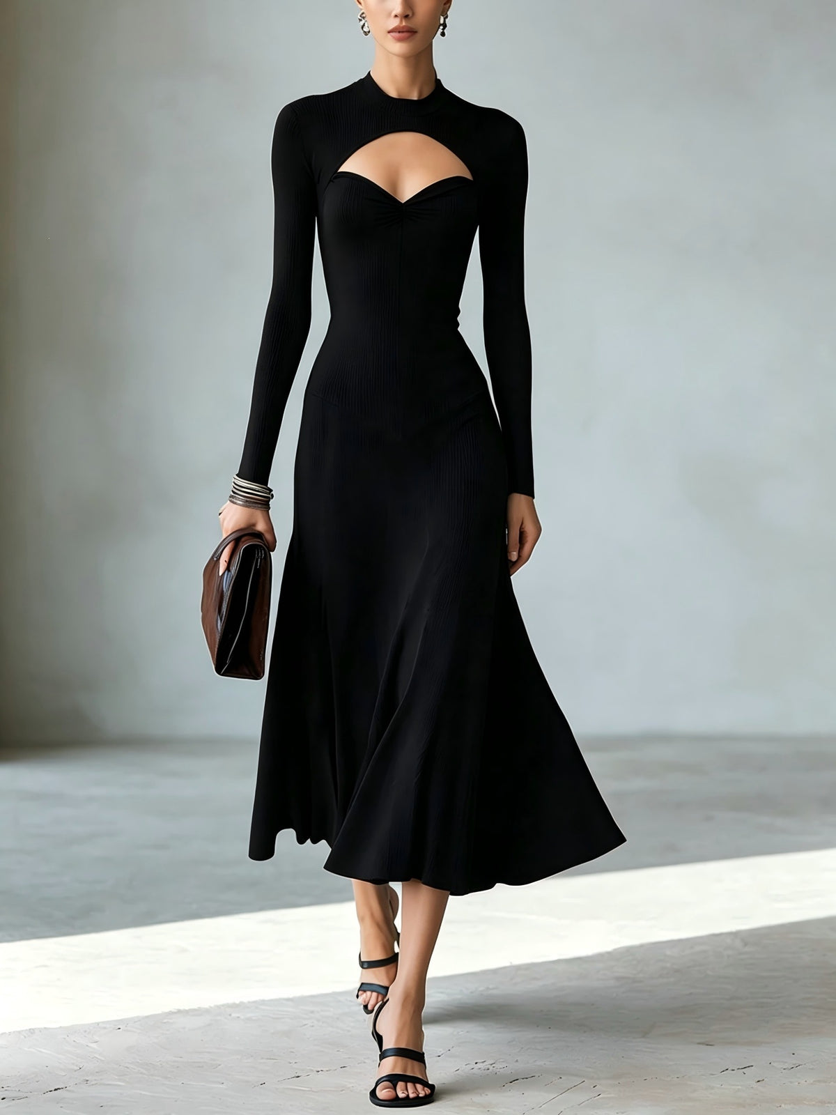 Black mock-neck midi dress with long sleeves, chest cutout, flared skirt