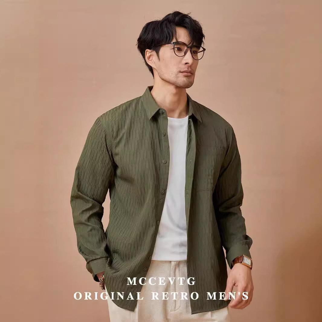 Green pleated long-sleeve button-up shirt with stand collar