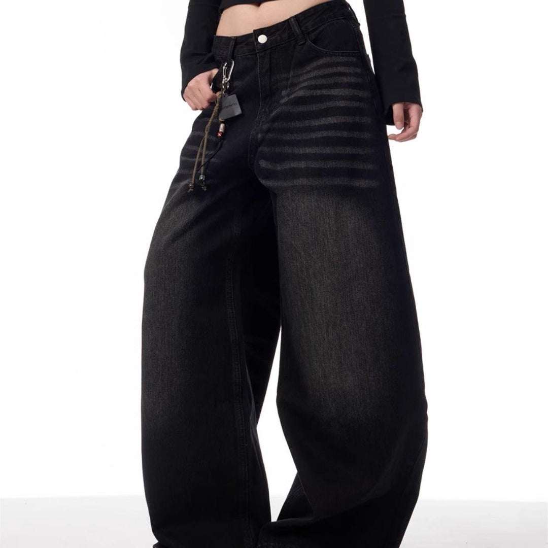 Black washed straight-leg jeans with button fly and metal zipper, low-rise fit