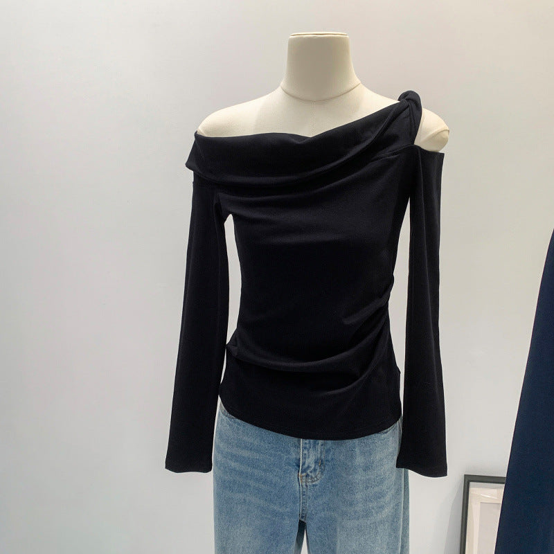 Black off-shoulder long-sleeve fitted top with draped asymmetrical neckline