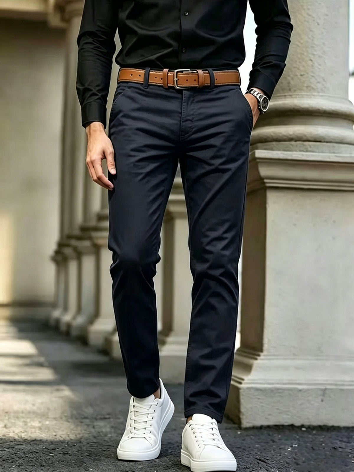 Navy slim-fit casual cotton pants with belt loops, tapered legs.