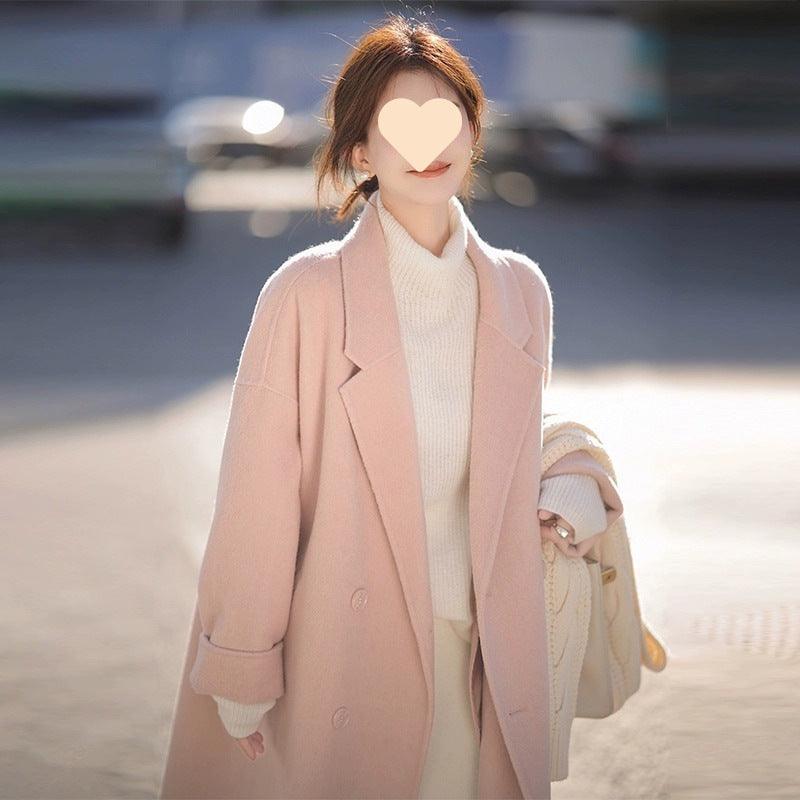 Women’s mid-length blush pink double-breasted wool trench coat with notched lapels