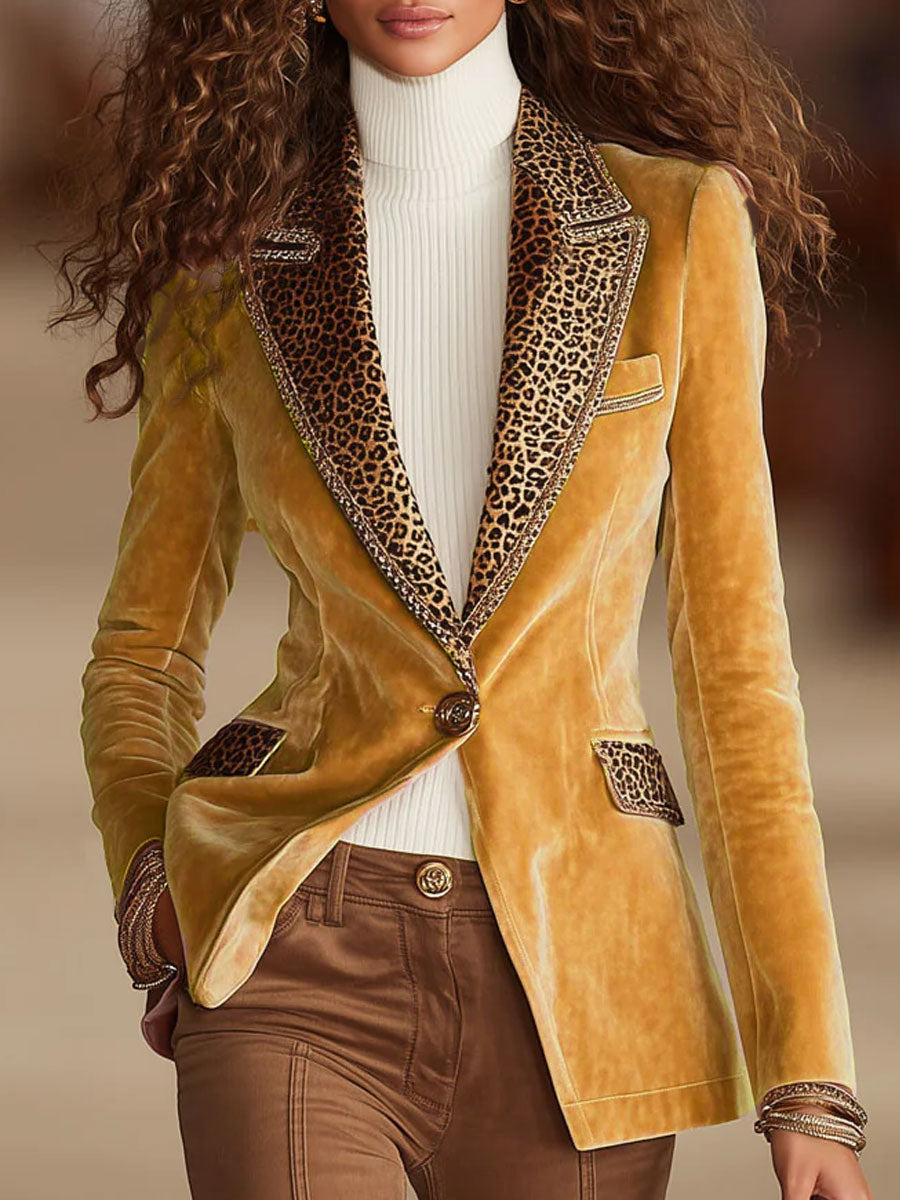 Women’s suit jacket with leopard-print peak lapels, gold blazer front, single button.