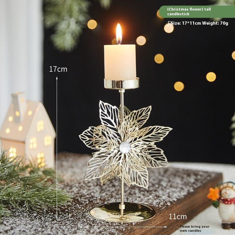Snowflake-shaped wrought iron candlestick holder with pillar candle and round base