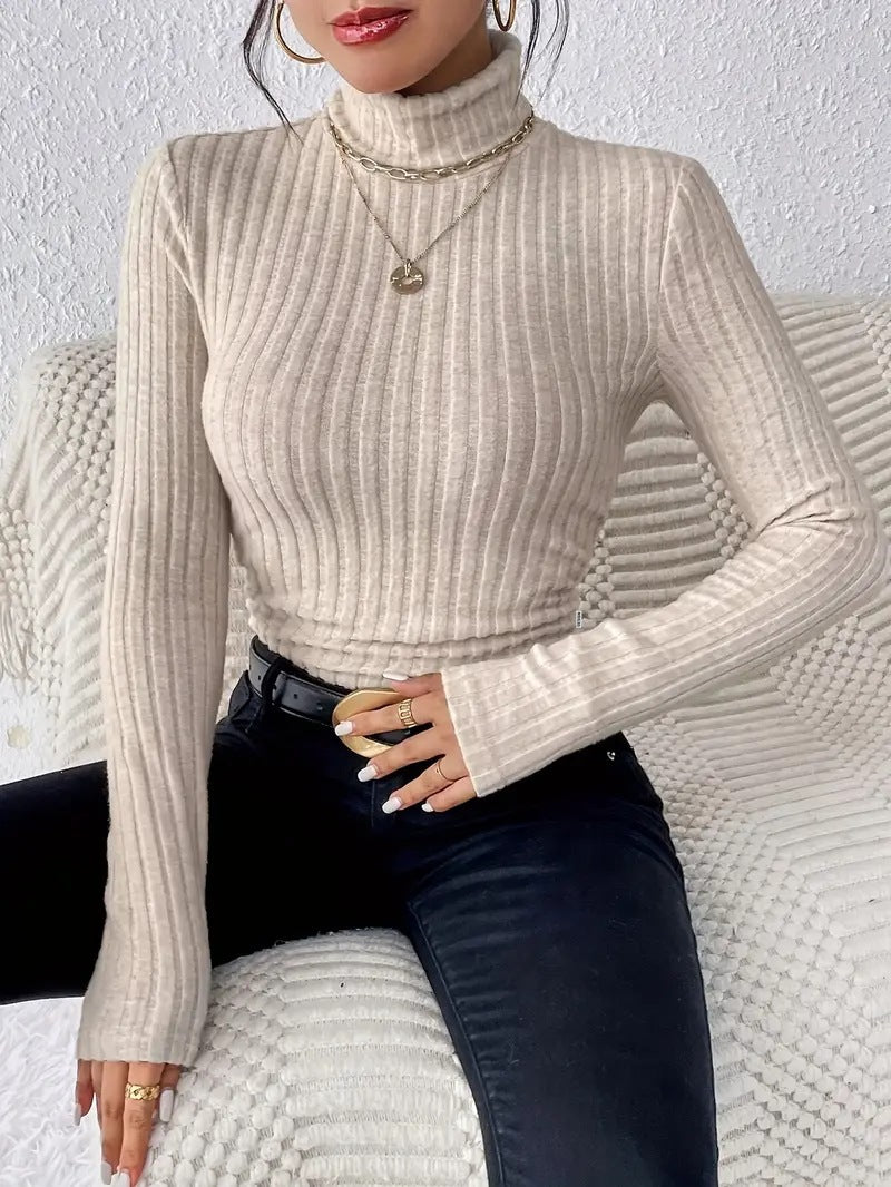 Light apricot ribbed knit turtleneck long sleeve top, smooth fitted torso