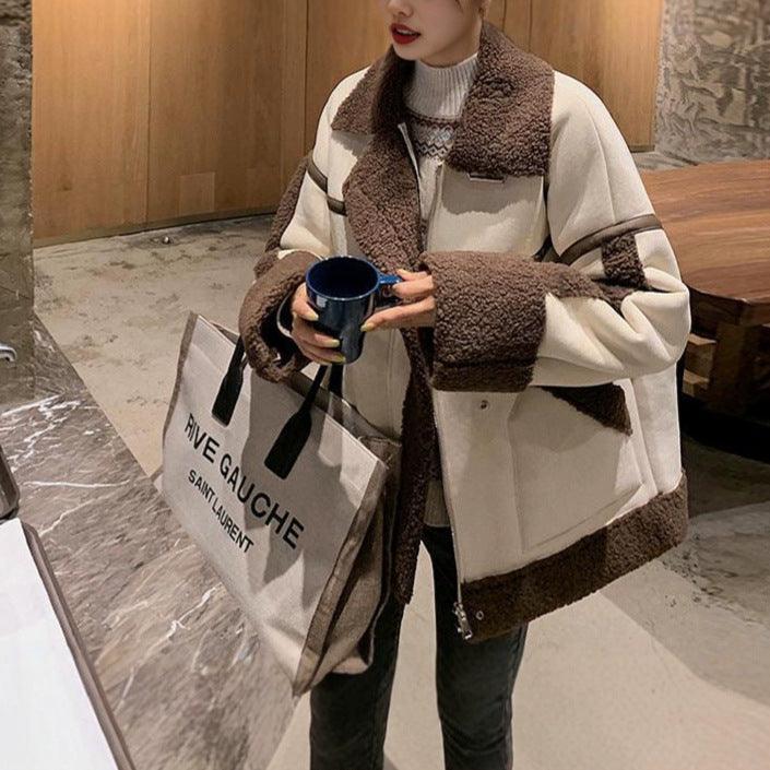 Women’s shearling-style coat with dark brown fur panels and cream body, zip front.