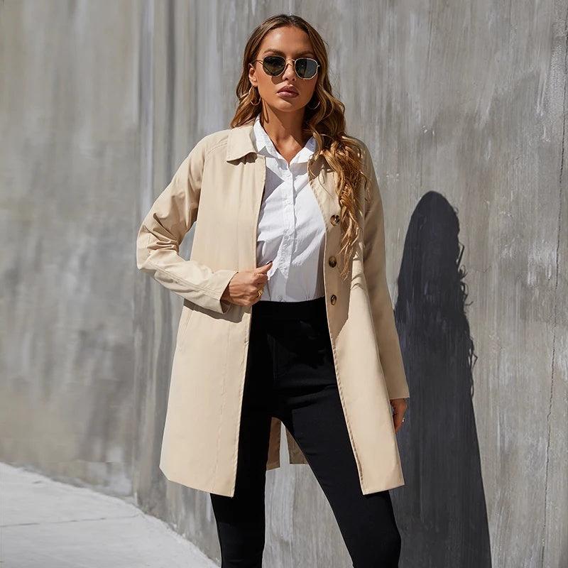 Women’s trench coat in light khaki with button front and notched lapels