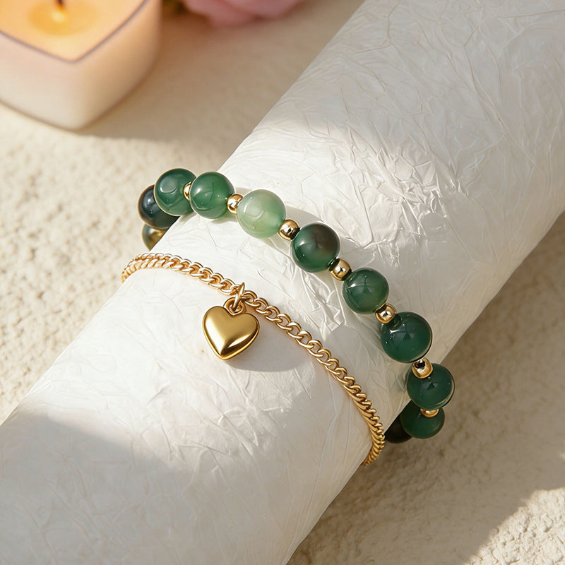 Green agate couple bracelet set with heart charm and round bead links, gold-tone chain
