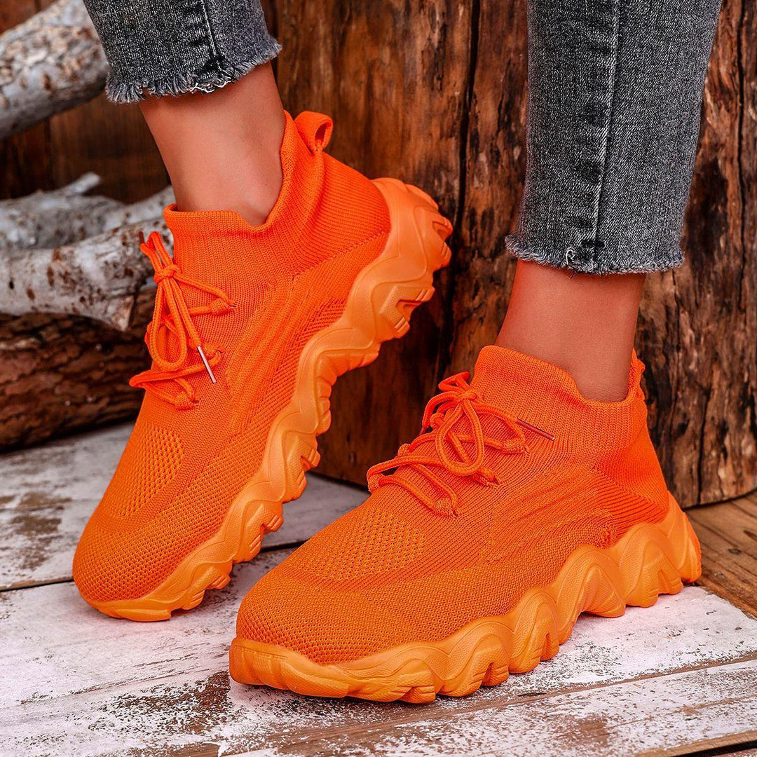 Women’s lace-up mesh sneakers, orange knit upper and chunky cushioning sole