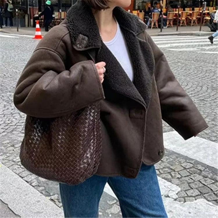 Dark brown padded jacket with sherpa-style lining, button front, and flap pockets