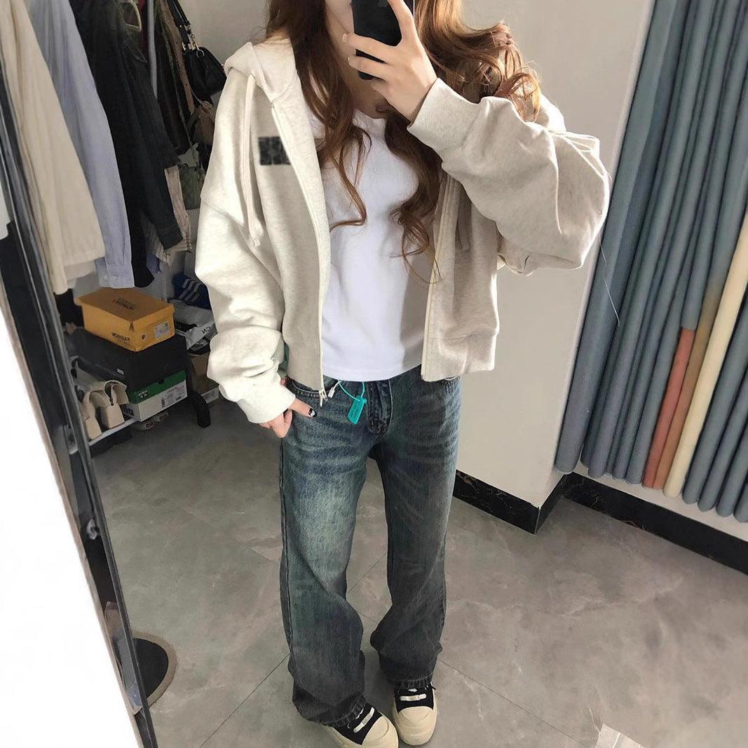 Cream hooded cardigan sweater with front zipper and long sleeves, relaxed fit