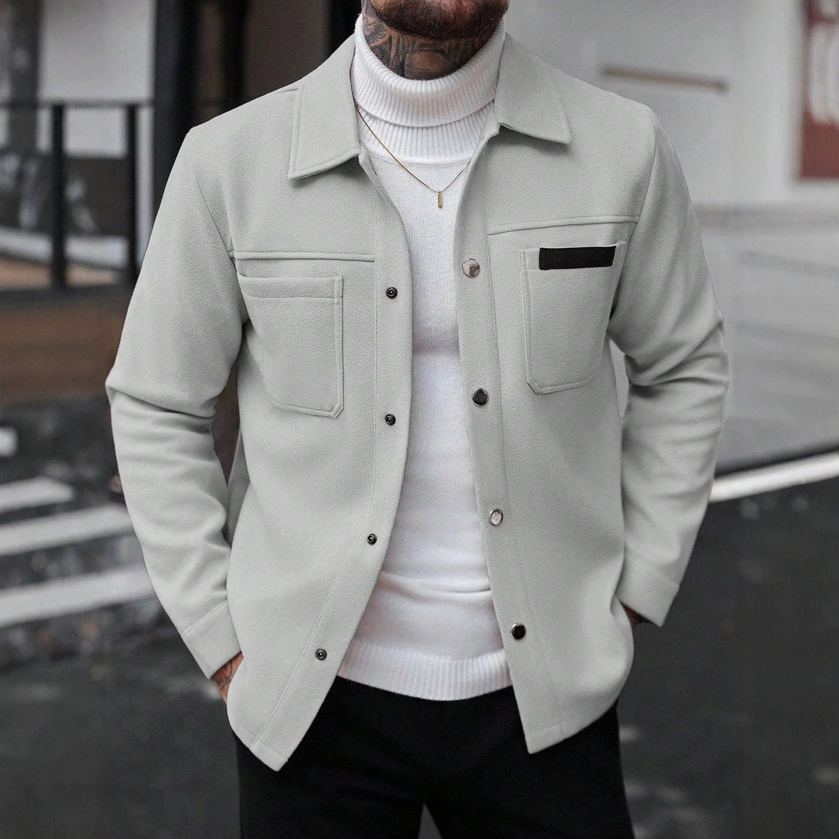 Light gray wool jacket with chest flap pockets, button front, pointed collar