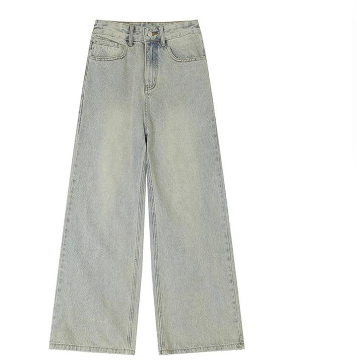 Light wash denim trousers with distressed straight wide-leg, loose fit, front pockets.