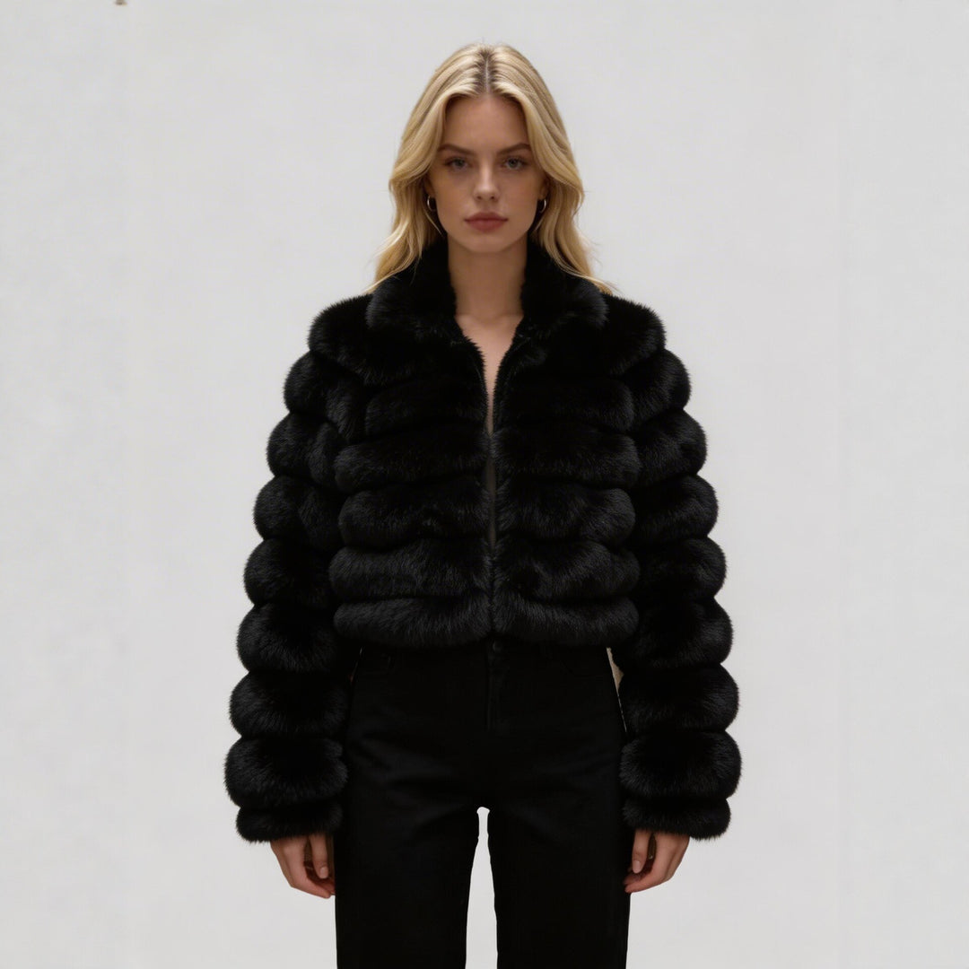Black faux fur zip-front coat with stand collar and chunky rounded panel sleeves