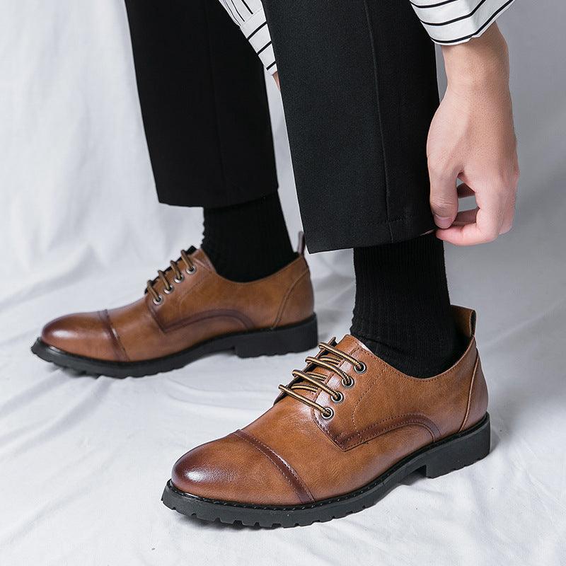 Men's brown leather lace-up shoes with stitched panels and rugged dark rubber sole