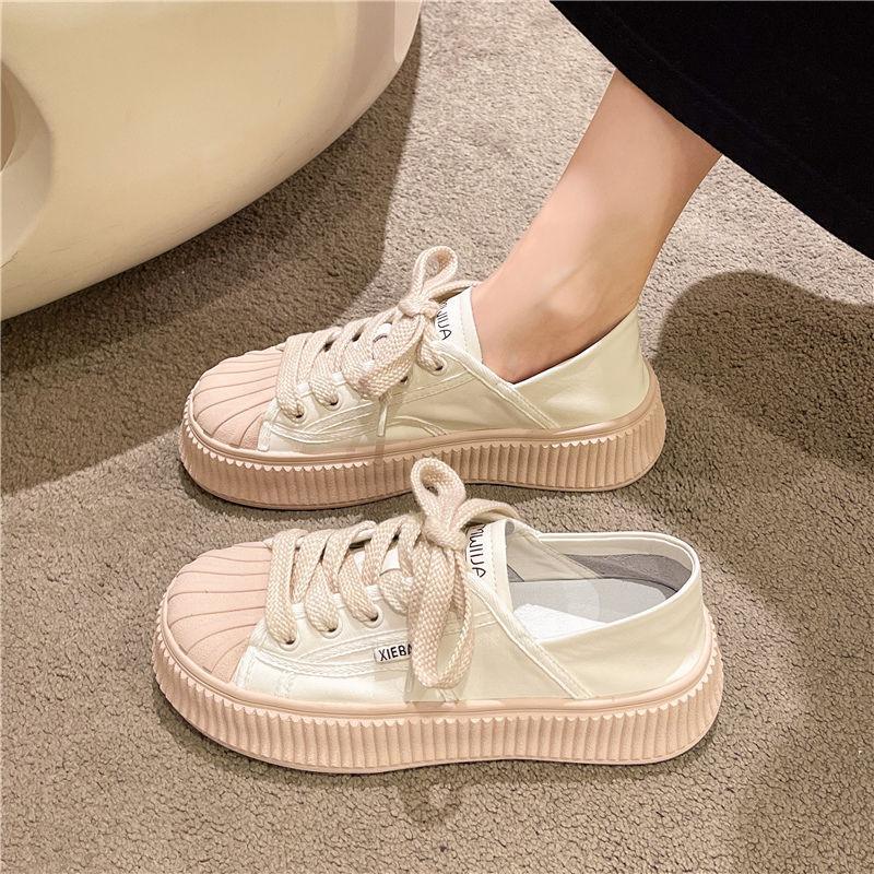 Light pink lace-up platform sneakers with chunky ridged midsole and padded collar
