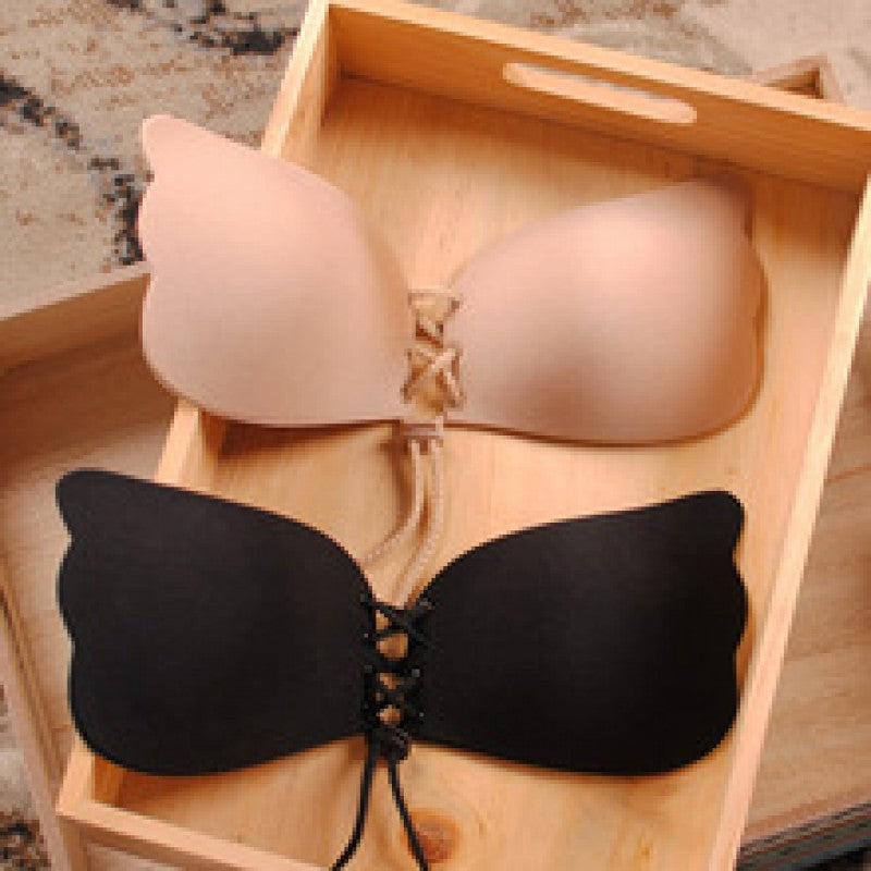 Strapless bra in black with scalloped cups and lace-up center ties