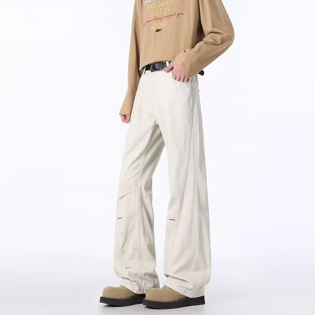 Men's off-white bootcut jeans with button-fly and side zipper, front view