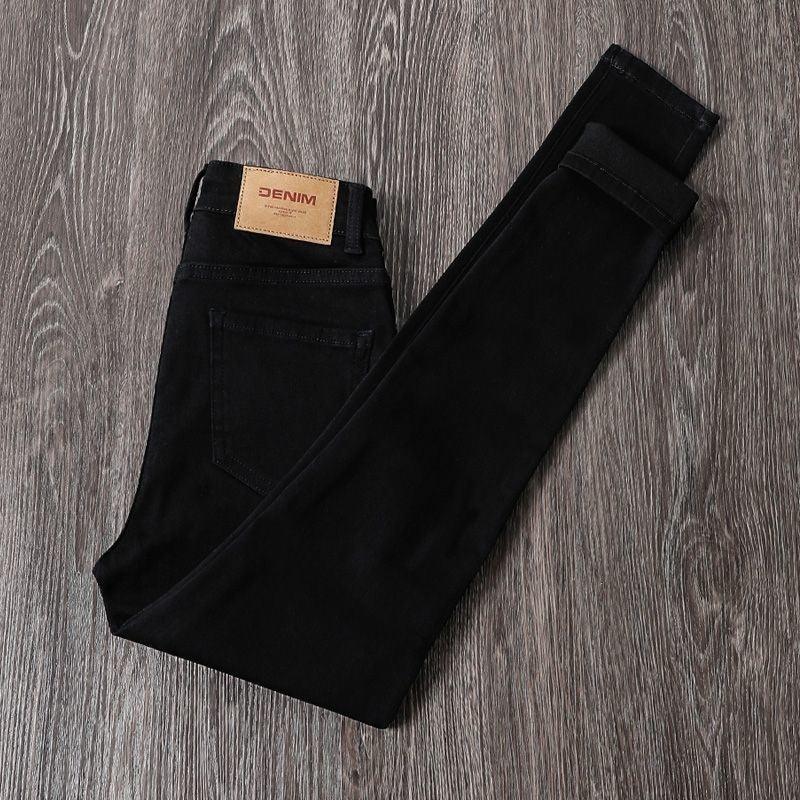 Black high-waist stretch jeans, five-pocket style, button fly, belt loops