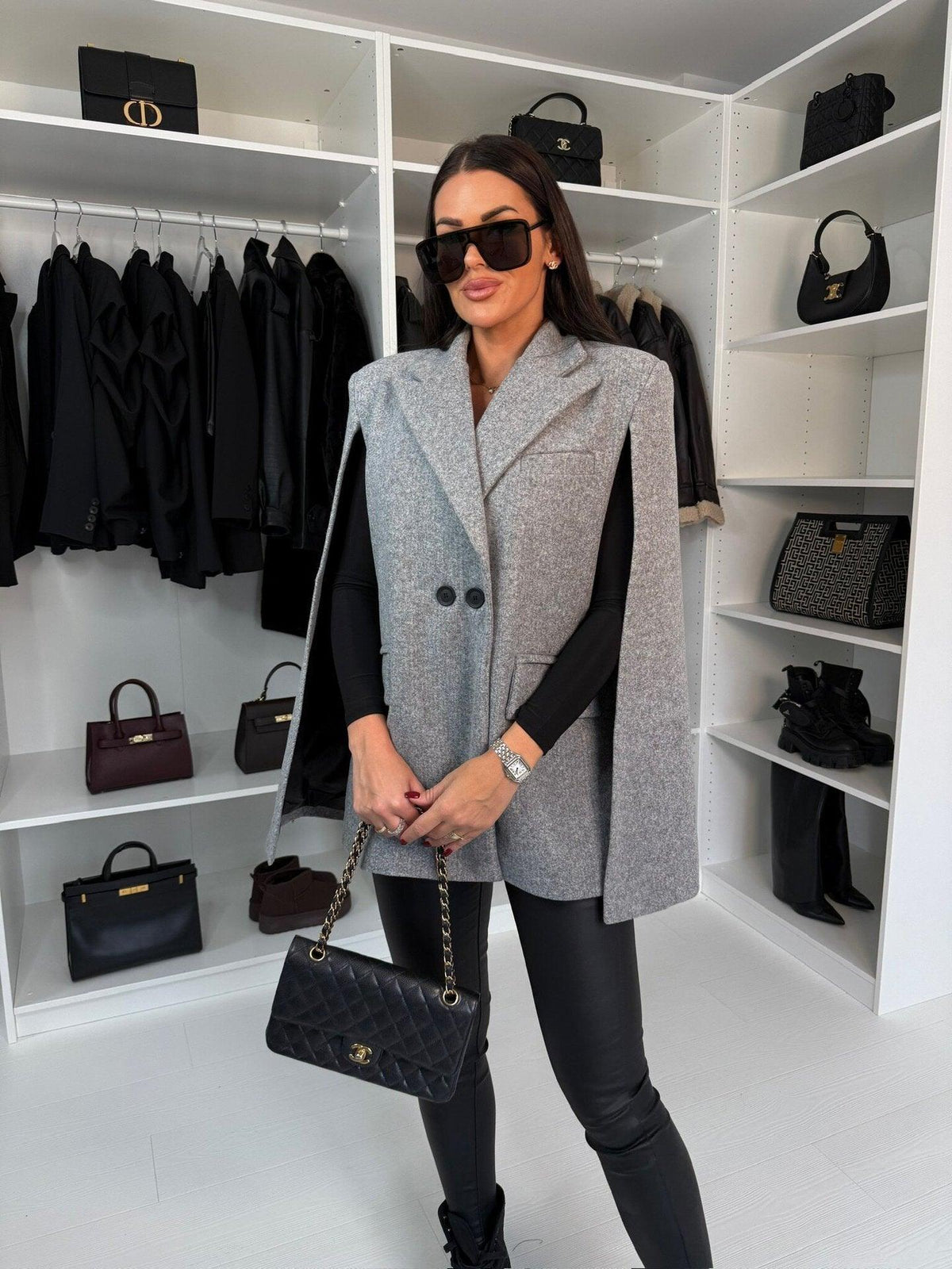 Gray shawl coat with notch lapels and two-button closure, long sleeves