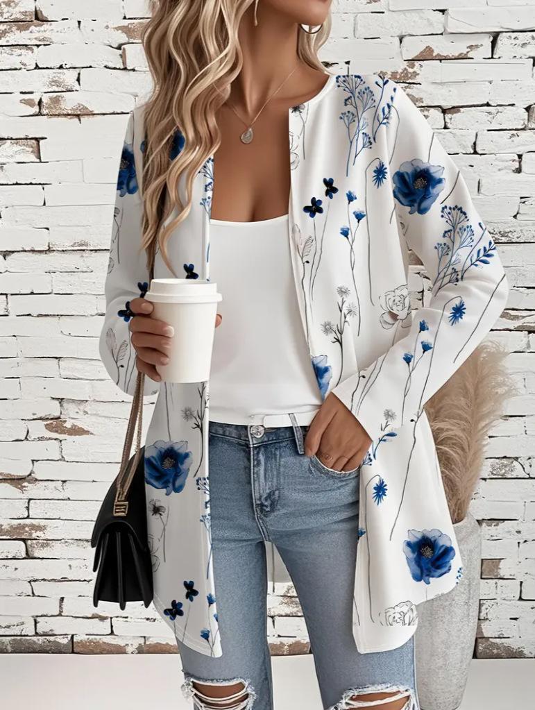 Womens mid-length long-sleeve coat, white with blue floral botanical print, open front.