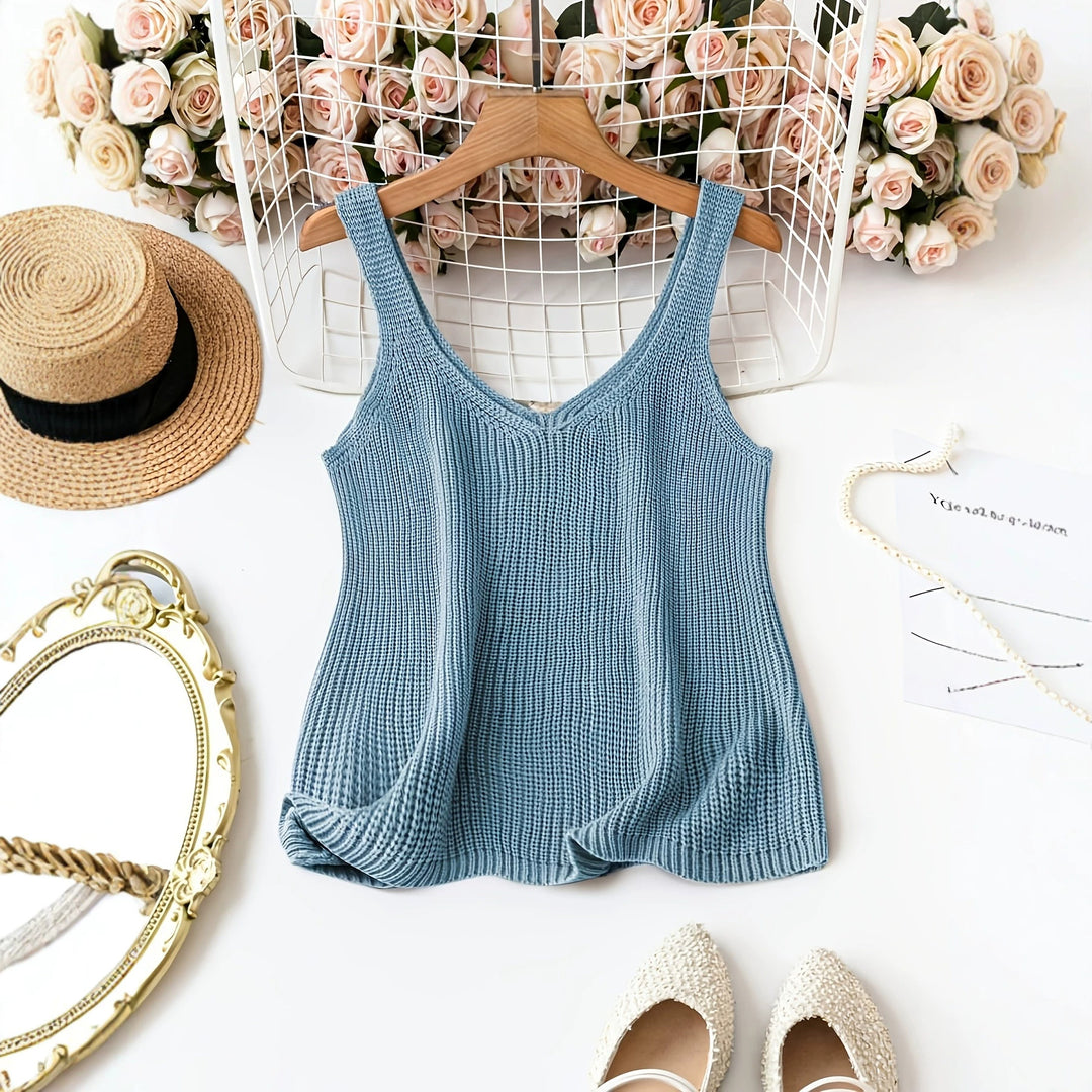Peacock blue ribbed sleeveless V-neck knit sweater with waist-cinching