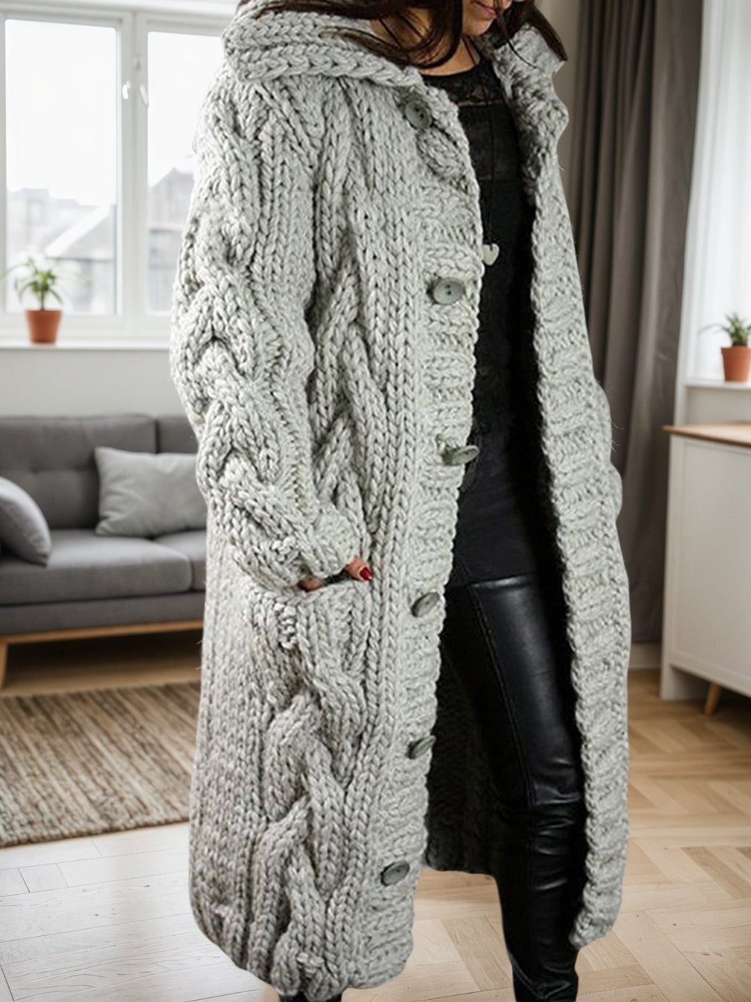 Light grey cable-knit cardigan sweater with rope-knot texture and button front