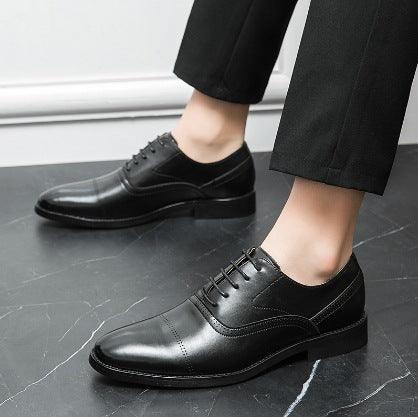Men's black leather lace-up oxford dress shoes with perforated detailing and low heel
