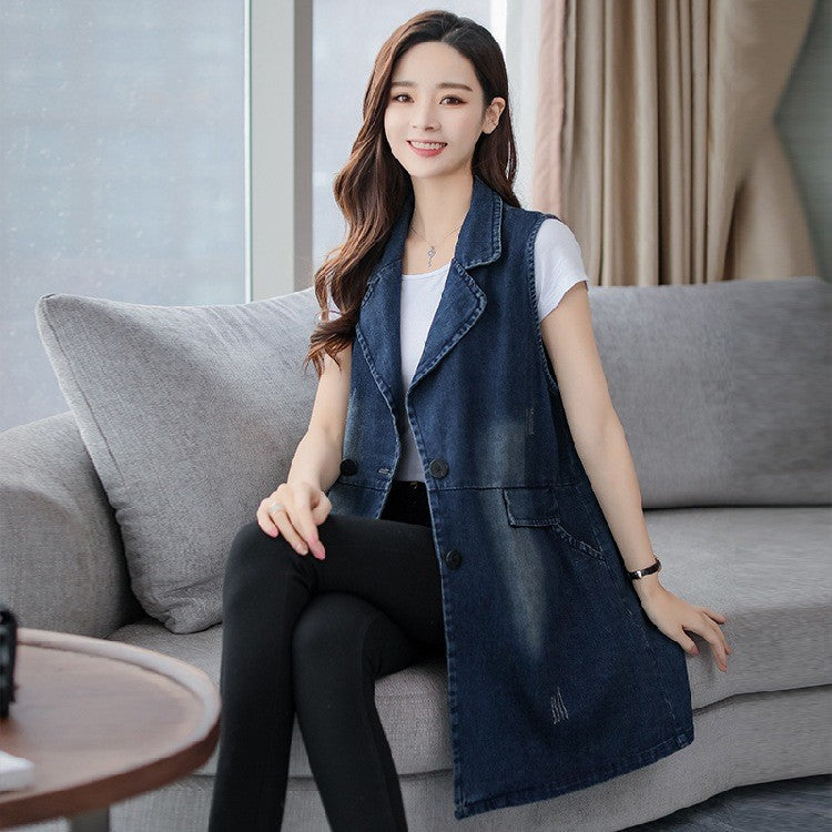 Blue denim sleeveless vest coat with double-breasted front buttons and two chest pockets